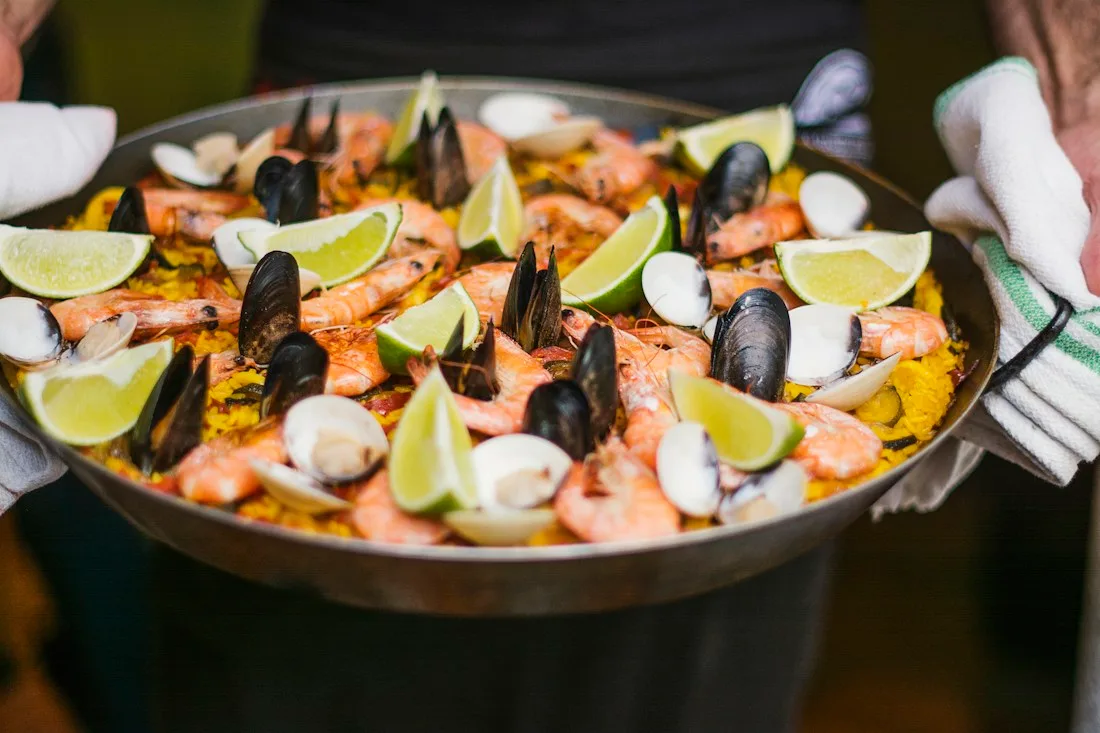Traditional Spanish paella at a shared table